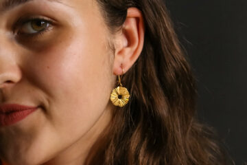 girl with earrings gold plated flower